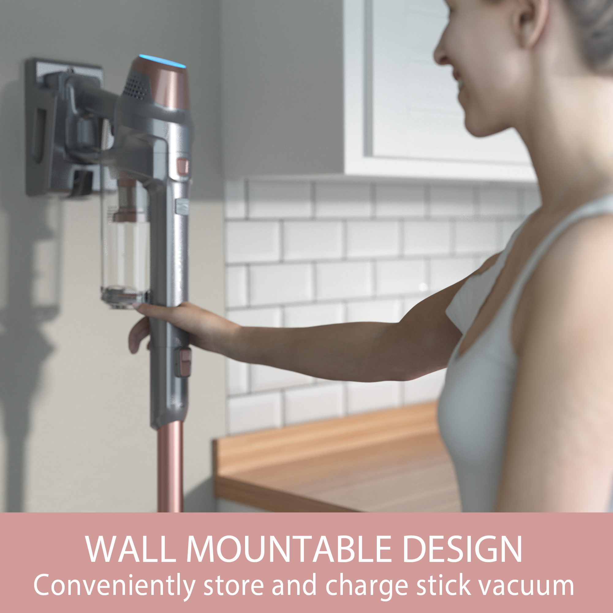 Woman using a wall-mounted stick vacuum cleaner in a kitchen.