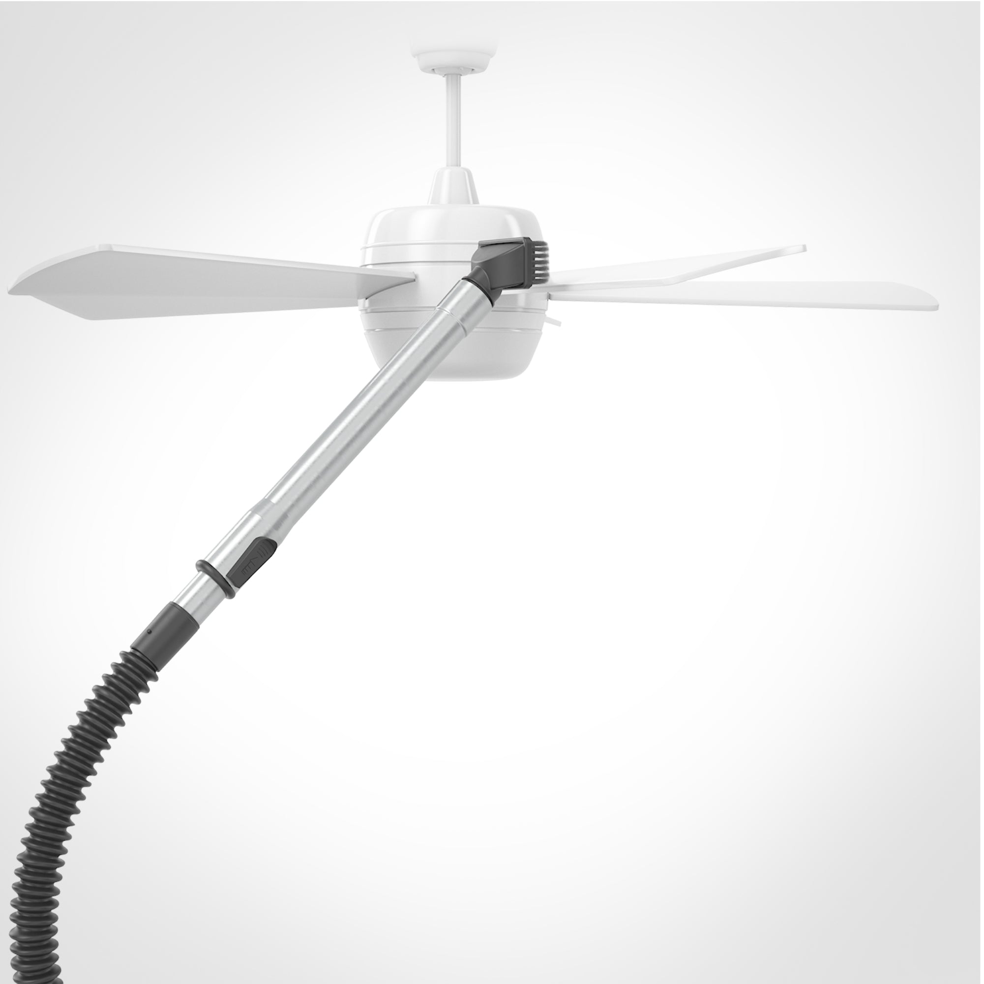 Vacuum hose and wand with a dusting brush attached is cleaning a ceiling fan on a white background