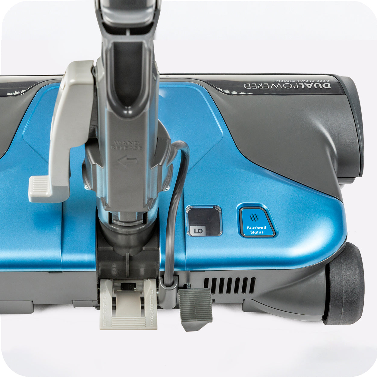 Close-up of a blue and gray vacuum cleaner on a white background