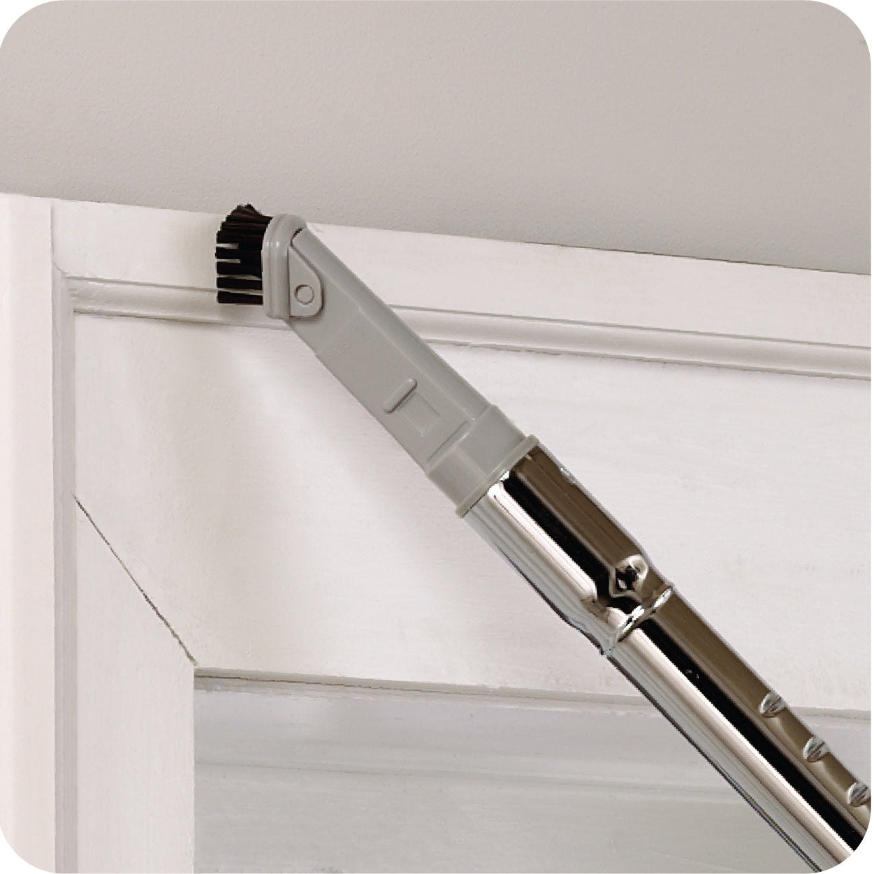 Dusting brush attachment for canister vacuum on a white background 