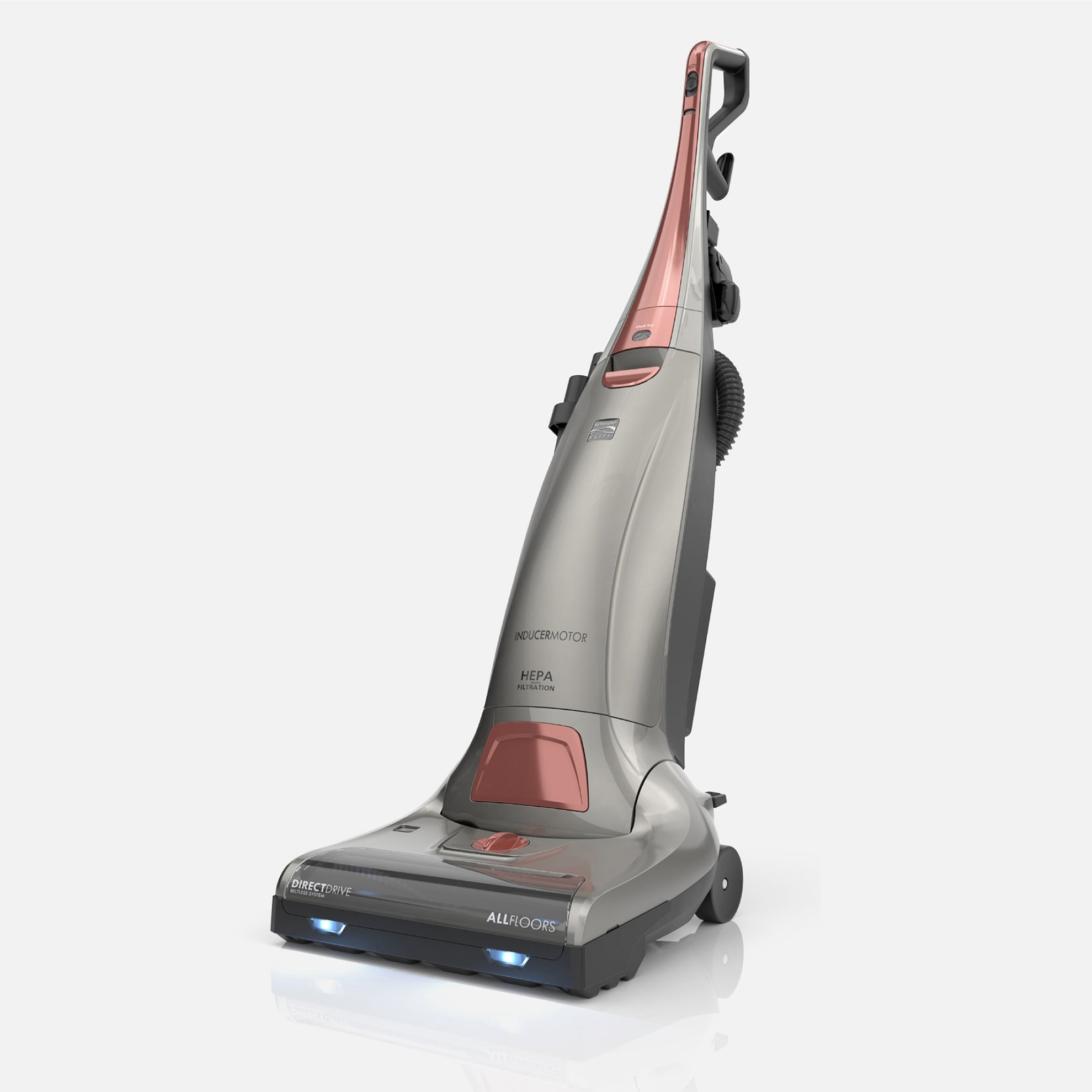 Gray and rose colored upright vacuum cleaner on a white background
